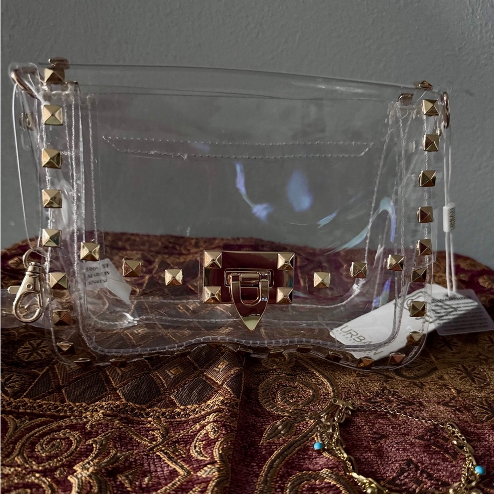 NWOT Fashion Jewelry Clear Crossbody Bag with Gold Accents.